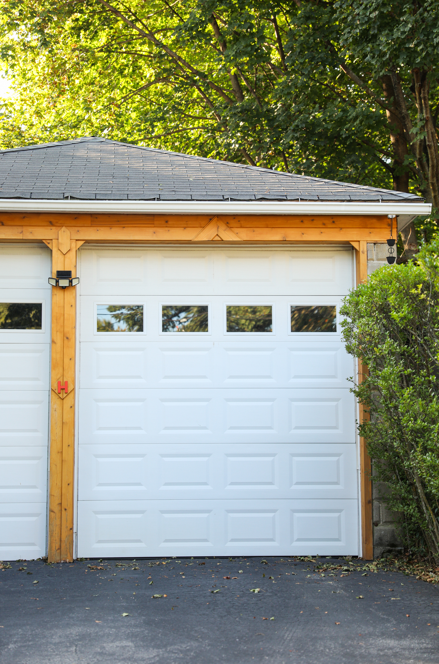 Modern double garage doors on Canadian home in winter