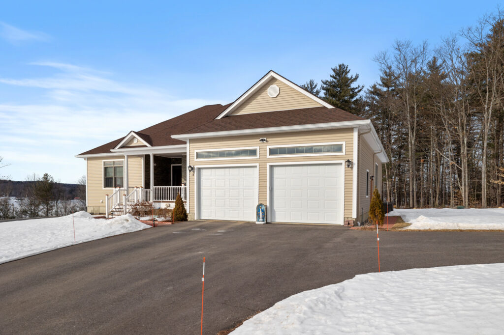 Modern double garage doors on Canadian home in winter