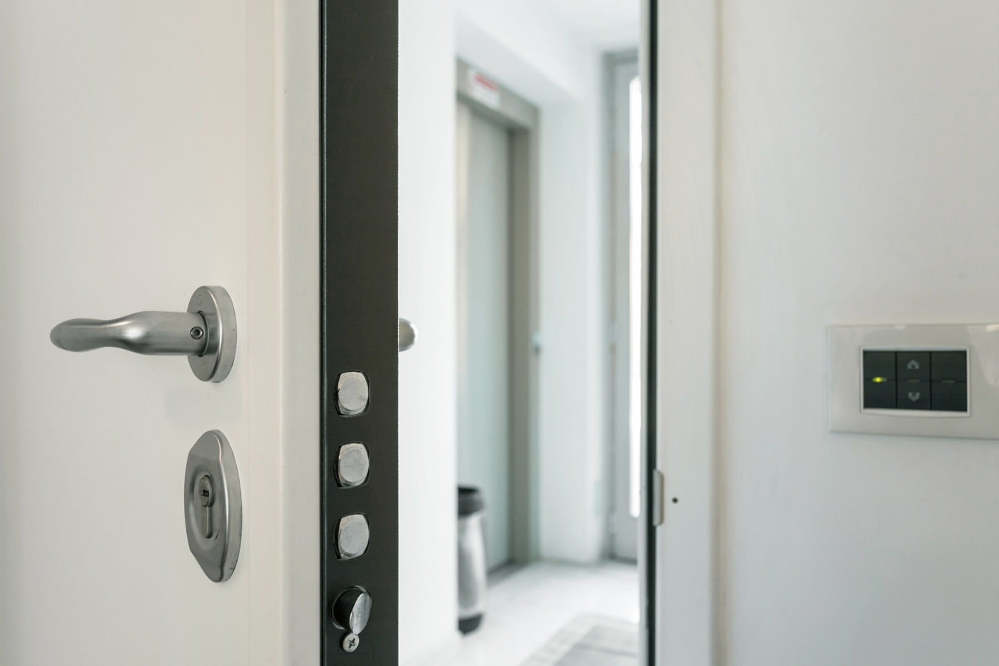 Locksmith installing high security lock on front door