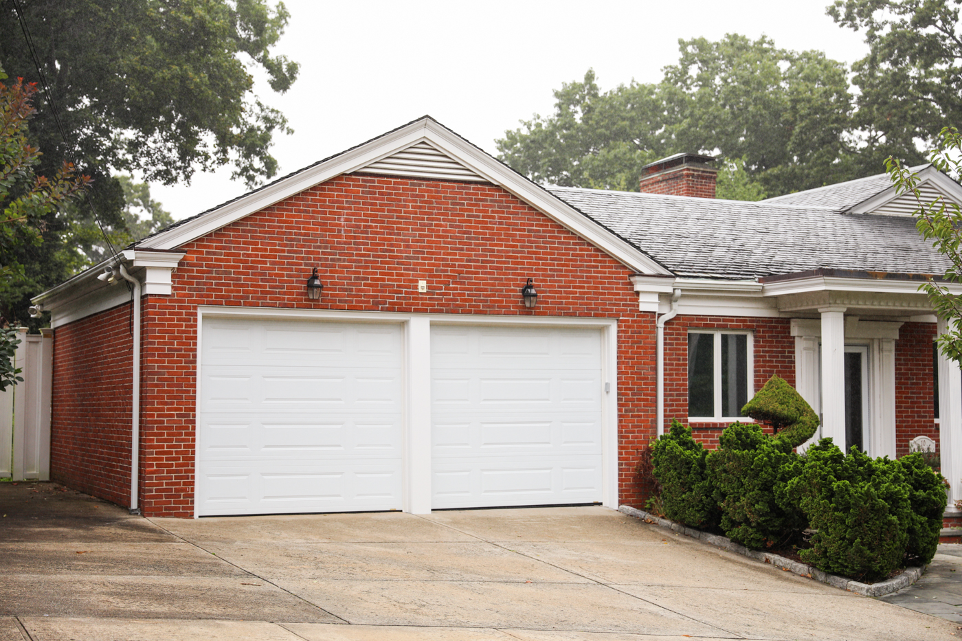 Modern wood garage door on Canadian home driveway
