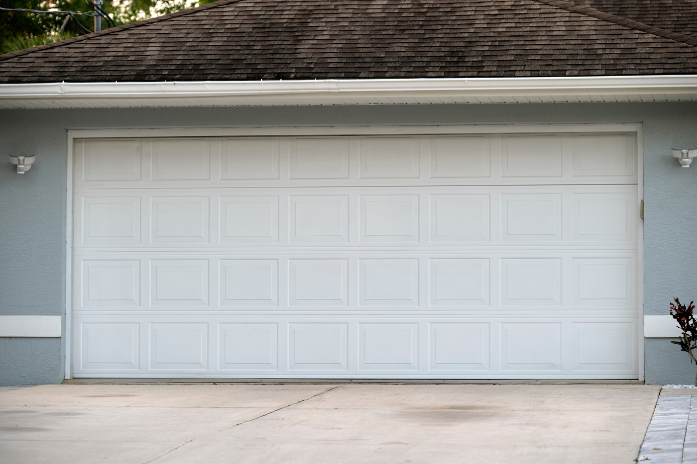 Modern white garage door on suburban Canadian home