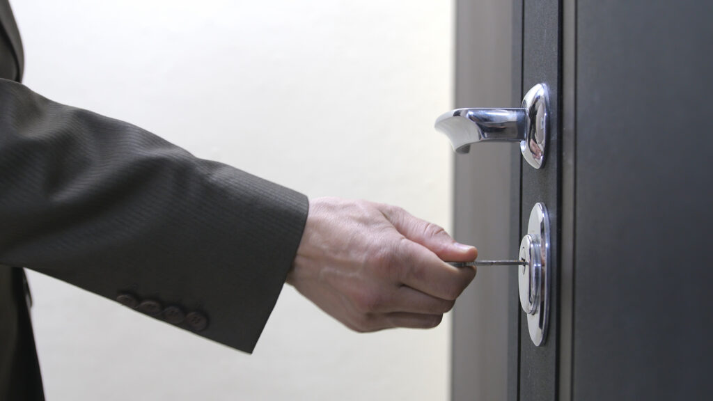 Unlocking chrome deadbolt lock on office door securely