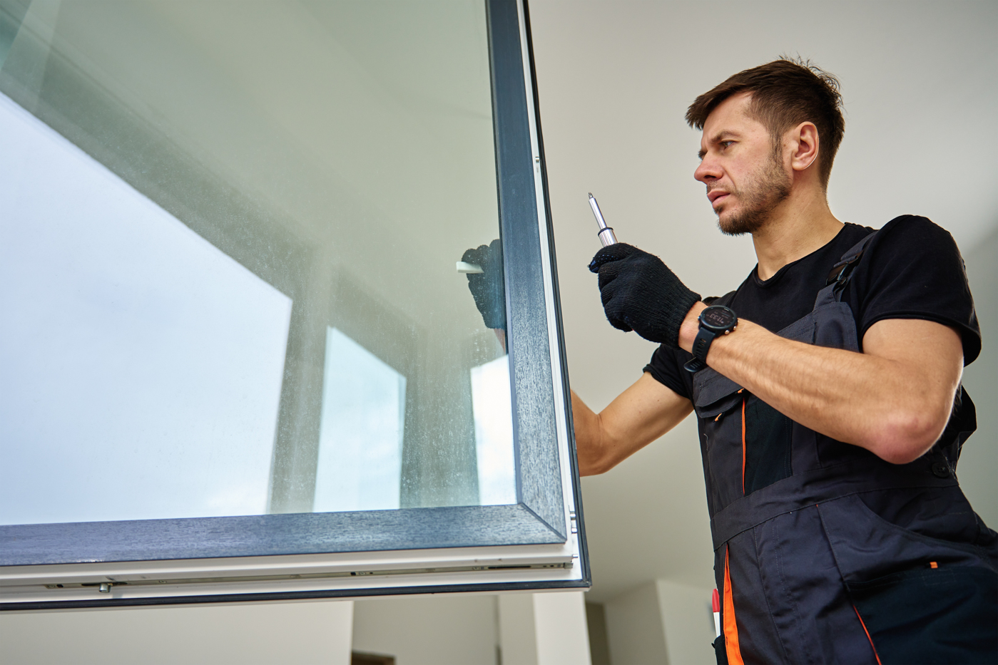 Fix Find technician installing vinyl window in condo
