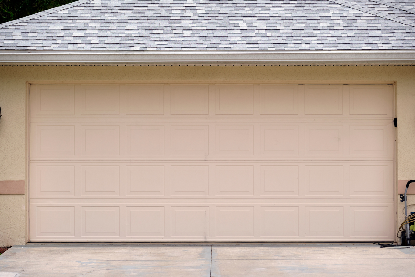 Modern garage door installation on Canadian home driveway