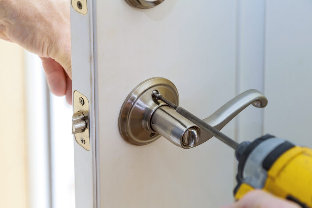 Locksmith installing renter-friendly door lock