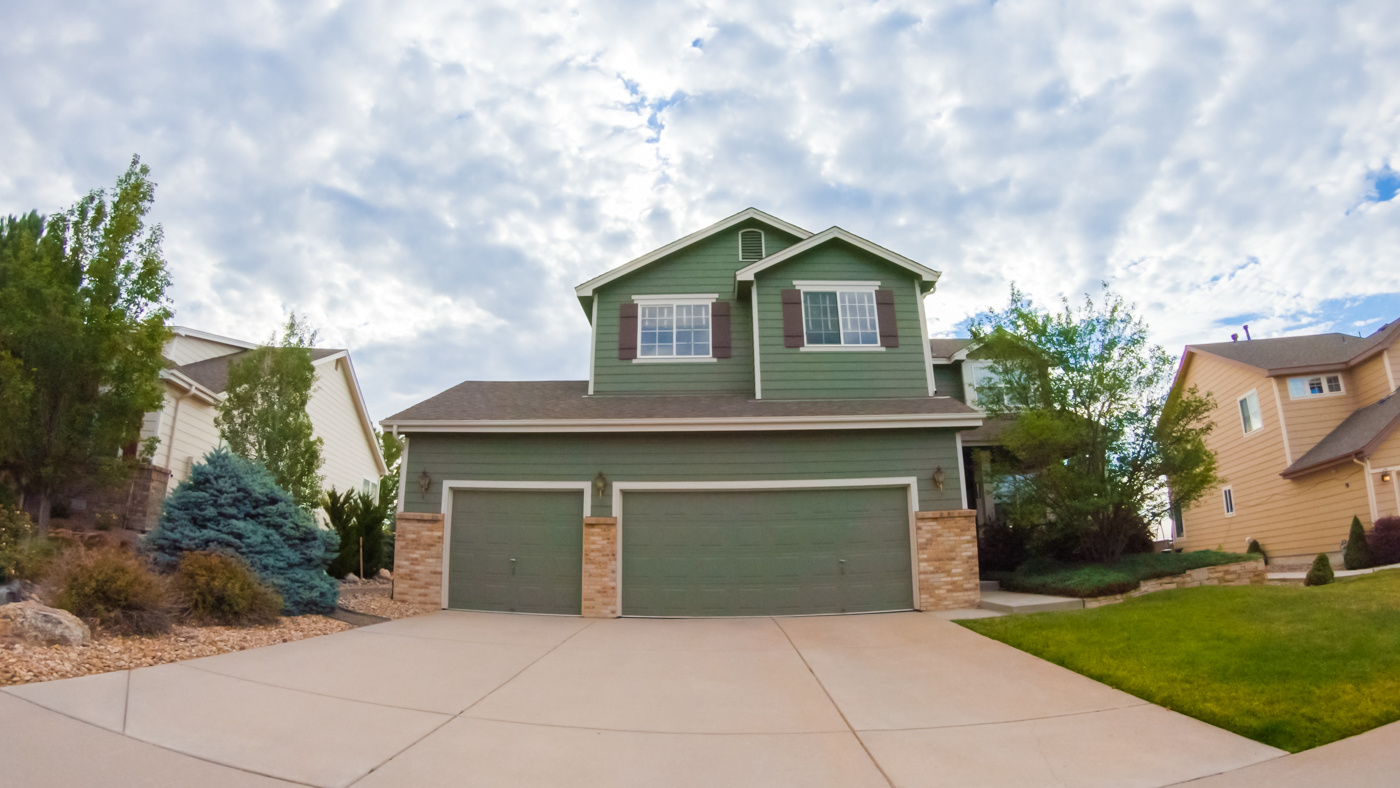 Modern home with wood garage door