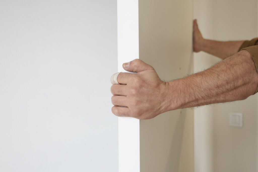 Hand installing interior wall panel