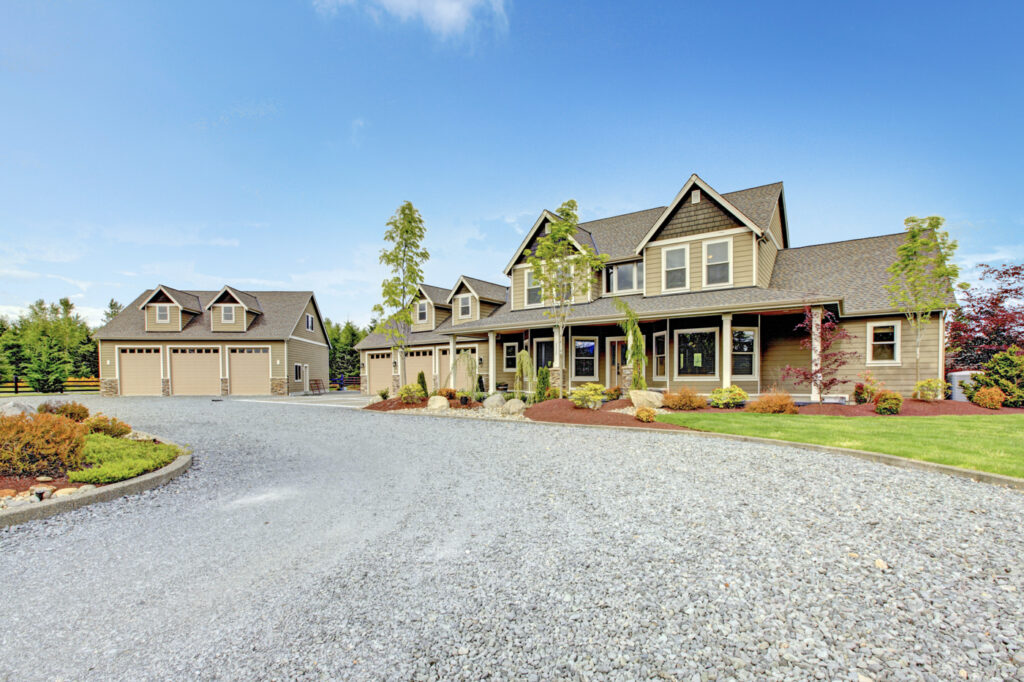 Large residential home with three garage doors