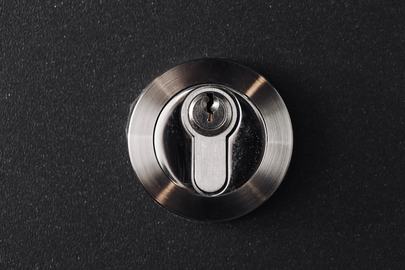 Locksmith installing door lock