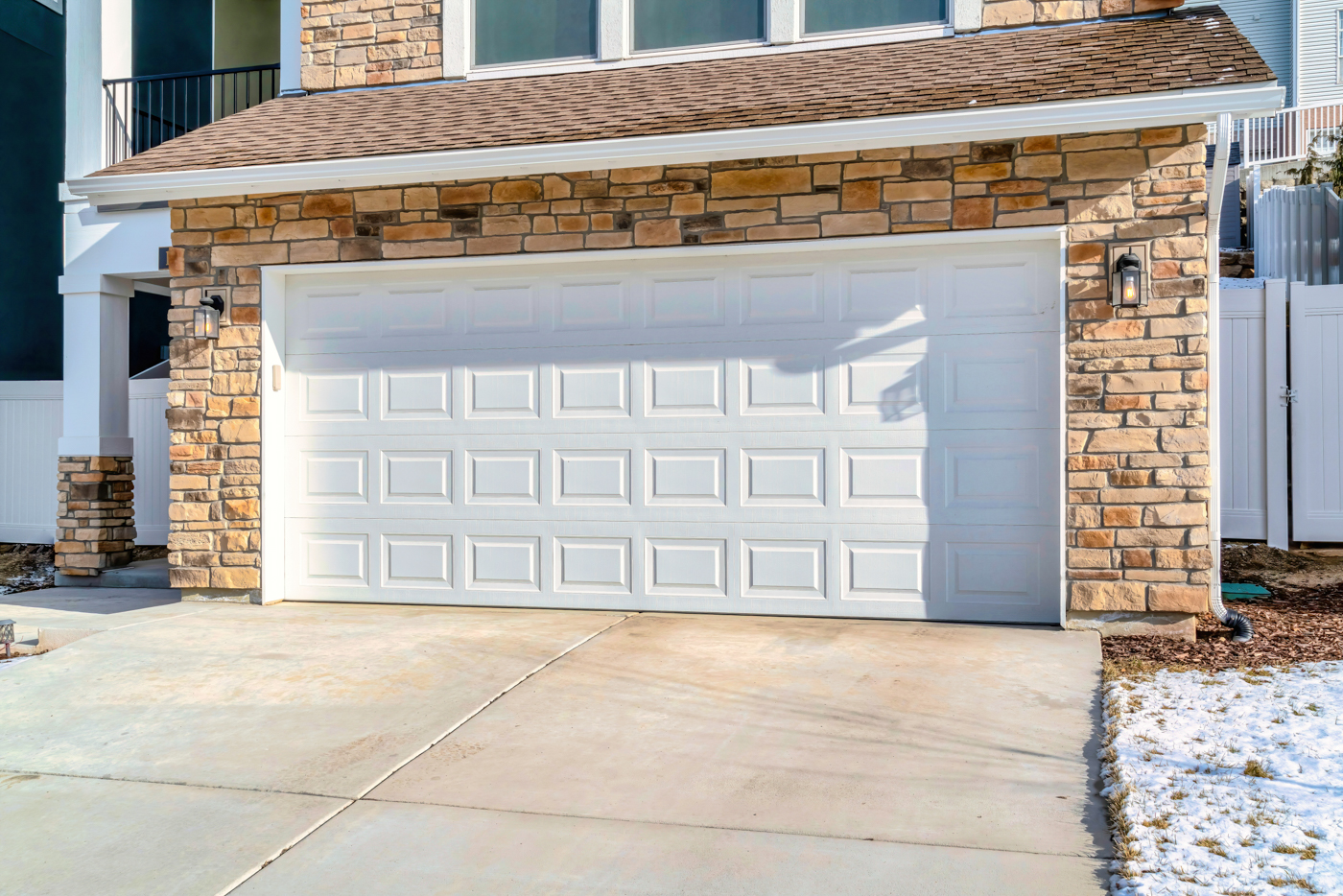 Modern black garage doors on suburban home